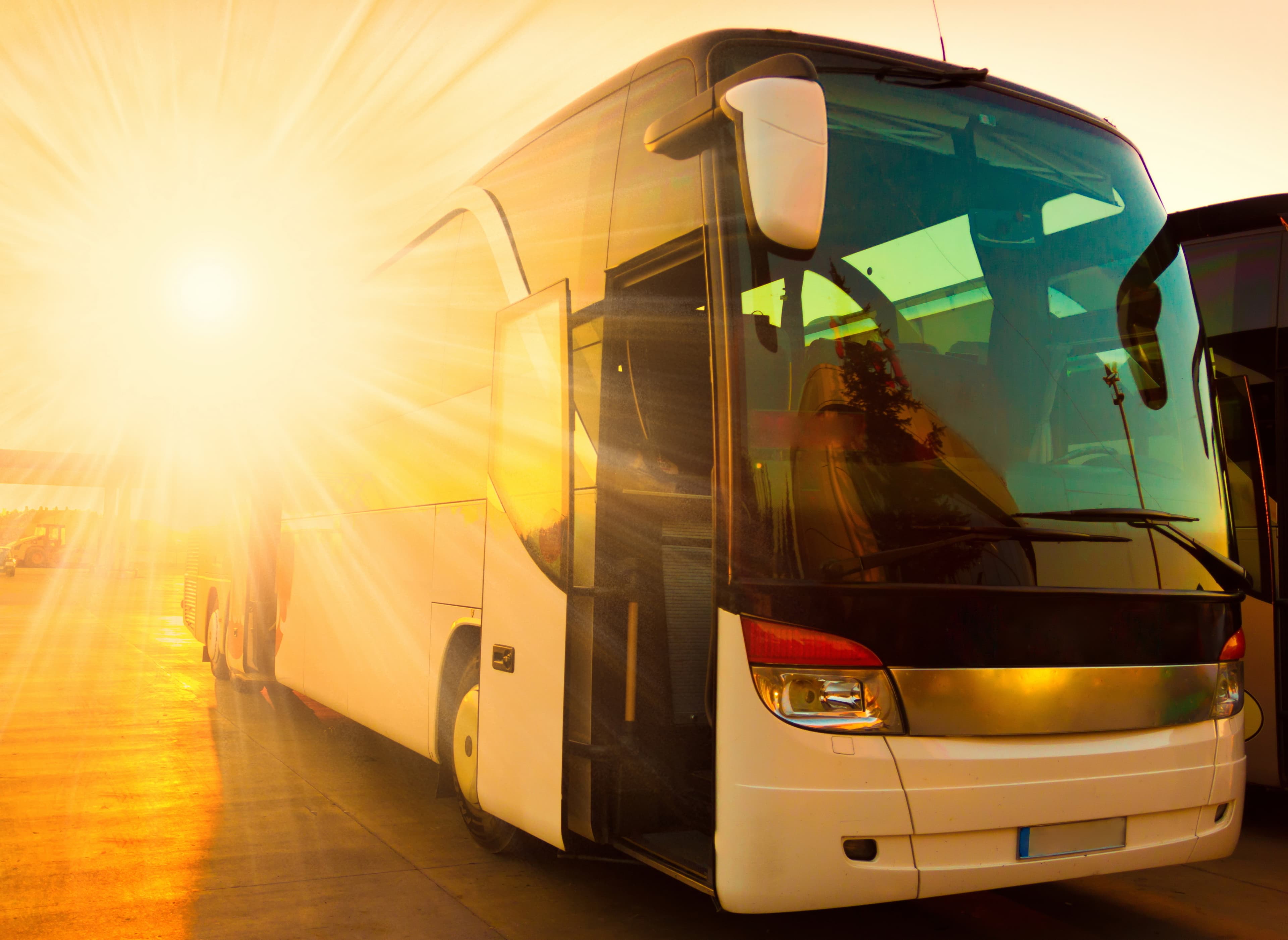 White coach with the sunset light from the background